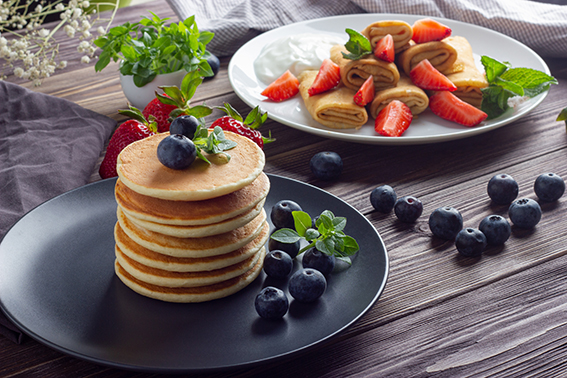 Pancakes,With,Fresh,Blueberry,,Strawberry,,Mint,And,Basil,Leaves,On